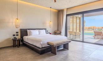 Naga Bay Swim-up-Juniorsuite mit Meerblick Schlafzimmer