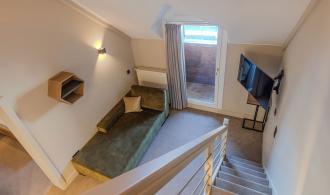 Familienzimmer mit/ohne Mansarde Schlanitzen Alm Treppenaufgang