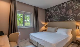 Rocca Nettuno Juniorsuite Gartenblick Schlafzimmer